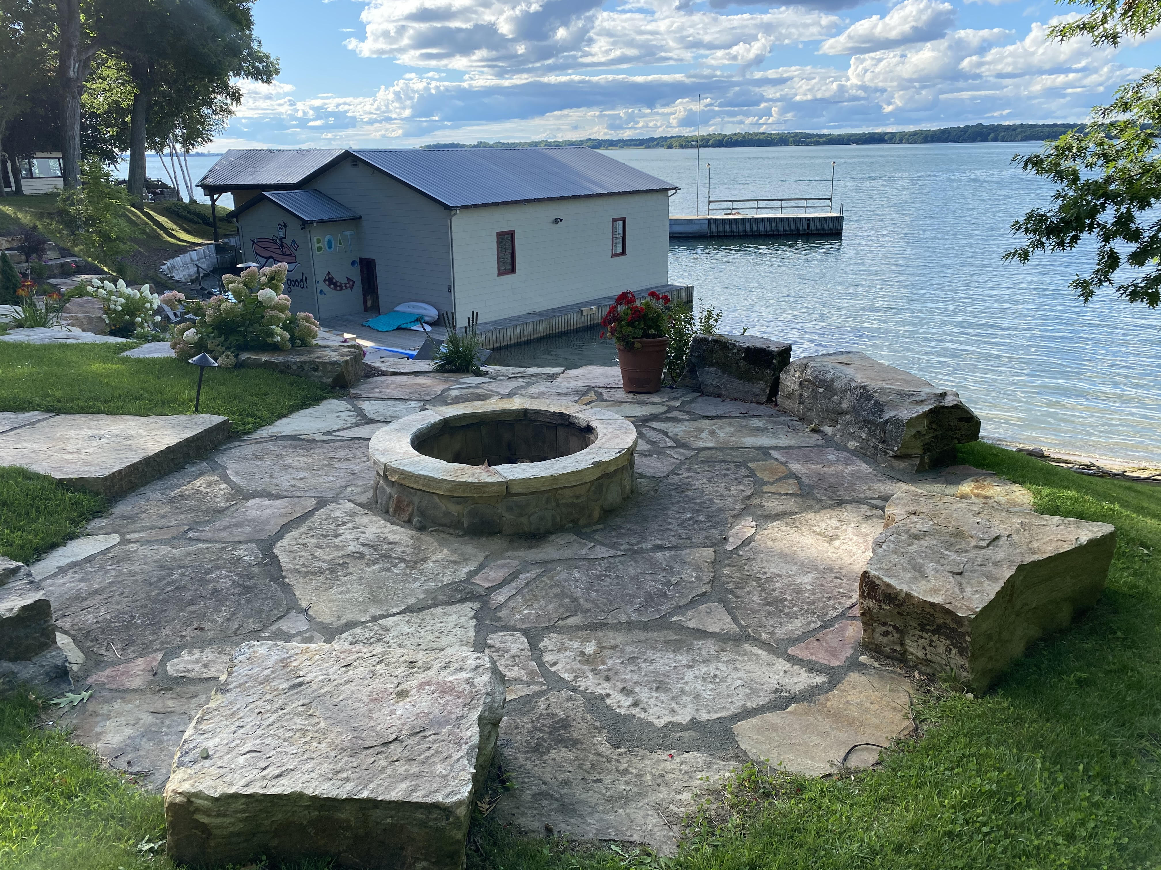 Flagstone Patio w Wood Fire Pit & Boulder Seating